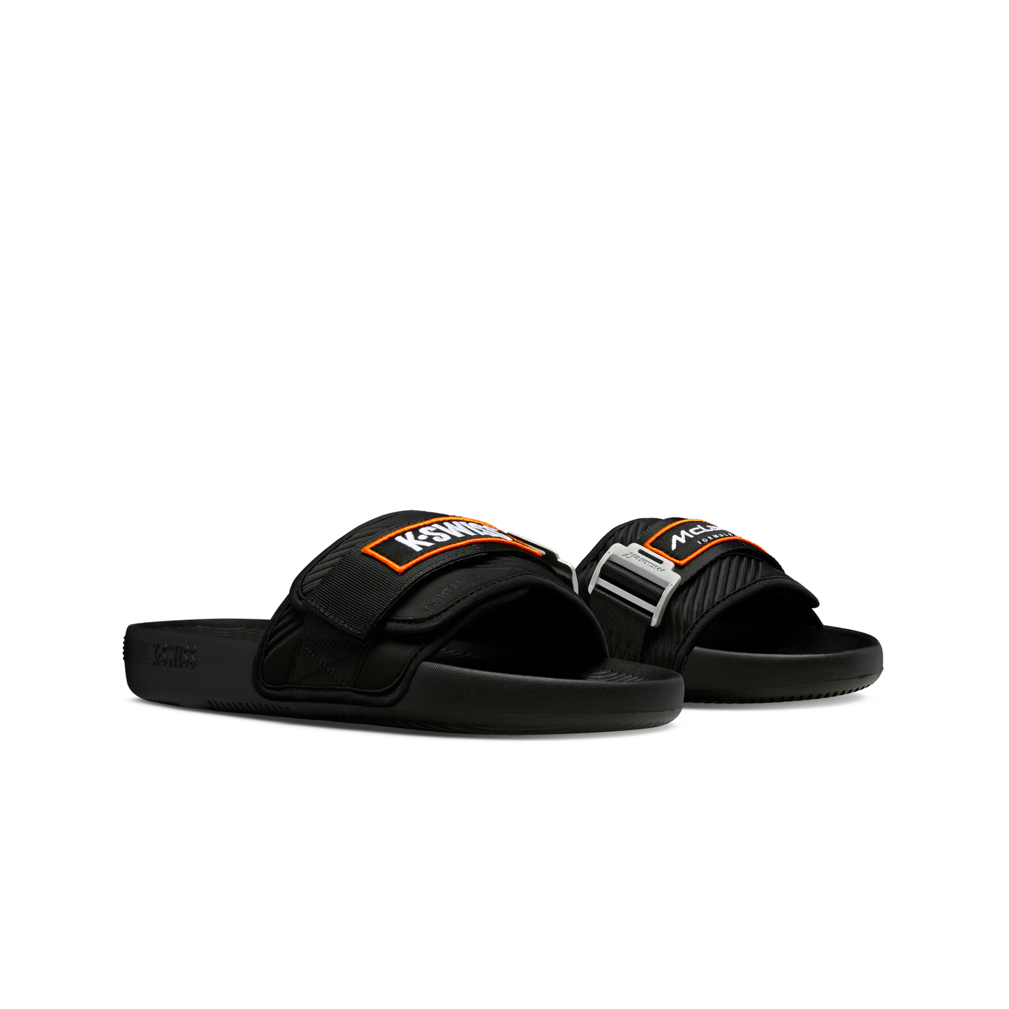 McLaren x K-Swiss black strap sandals with black and orange McLaren straps – front angled pair view