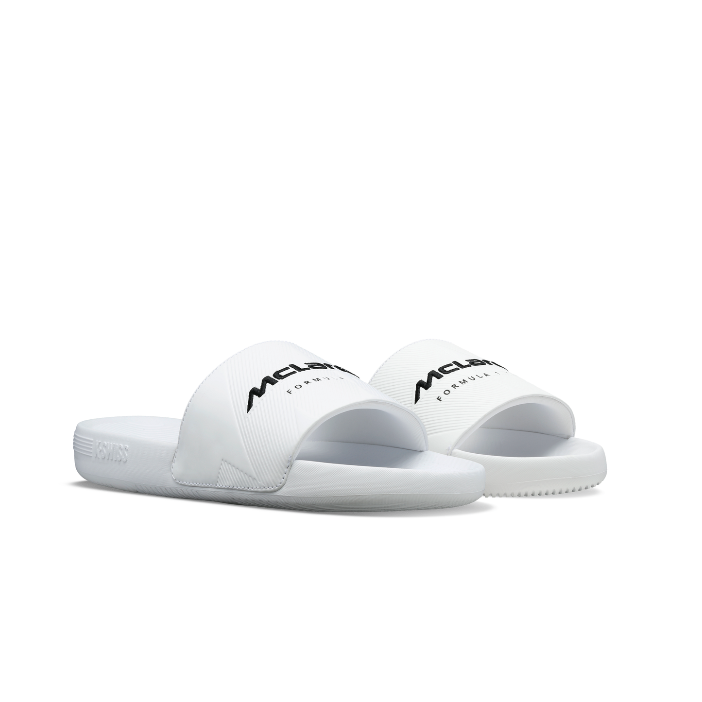 McLaren x K-Swiss white slide sandals with McLaren Formula 1 branding – front angled pair view