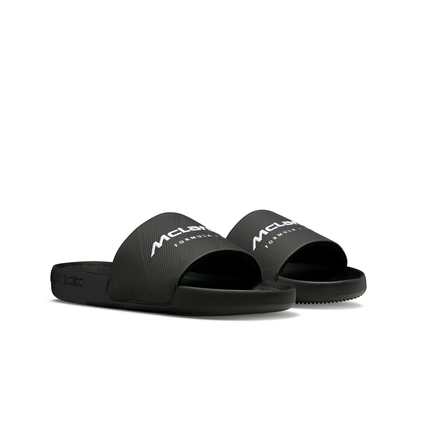 McLaren x K-Swiss black slide sandals with McLaren Formula 1 branding – front angled pair view