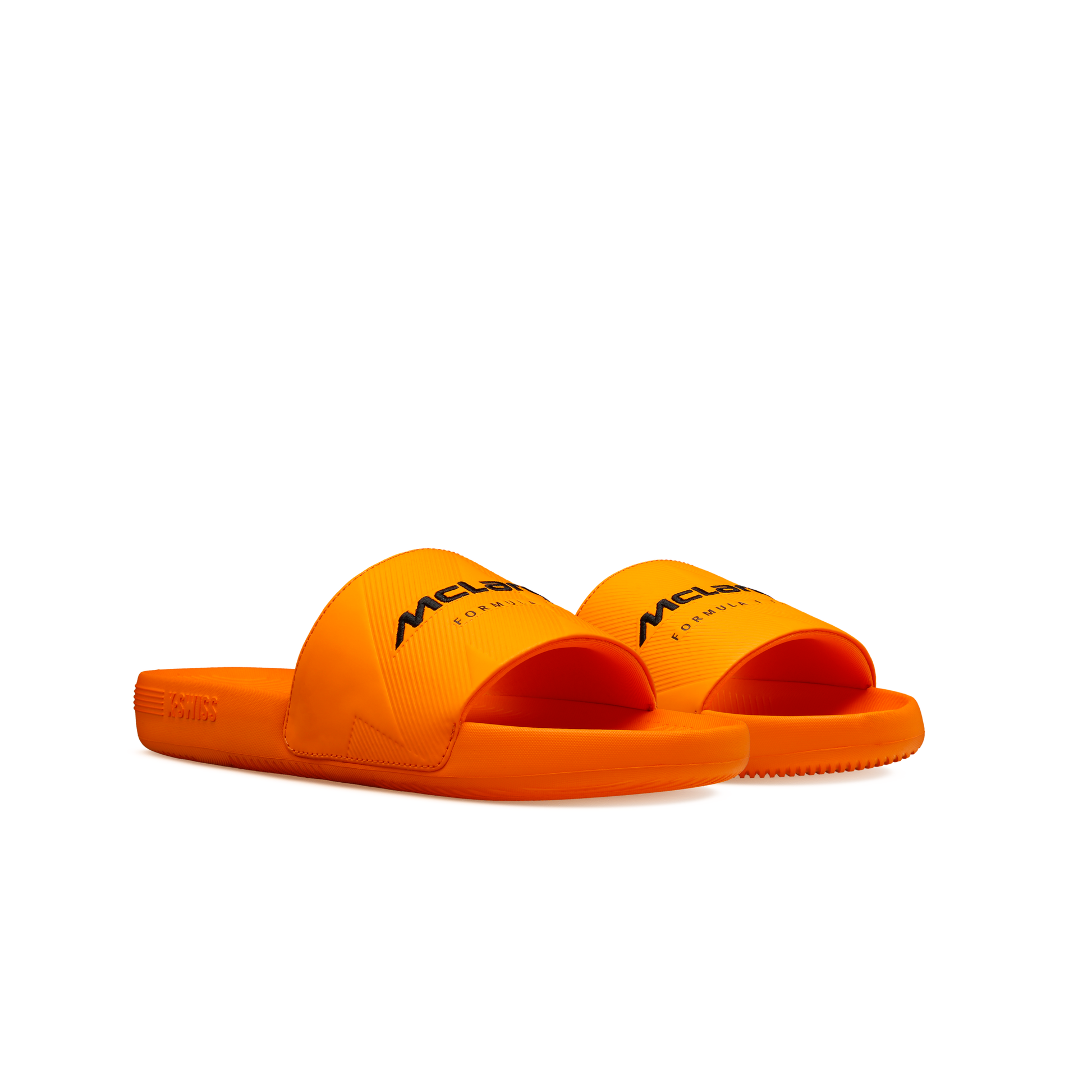 McLaren x K-Swiss papaya orange slide sandals with McLaren branding – front angled pair view