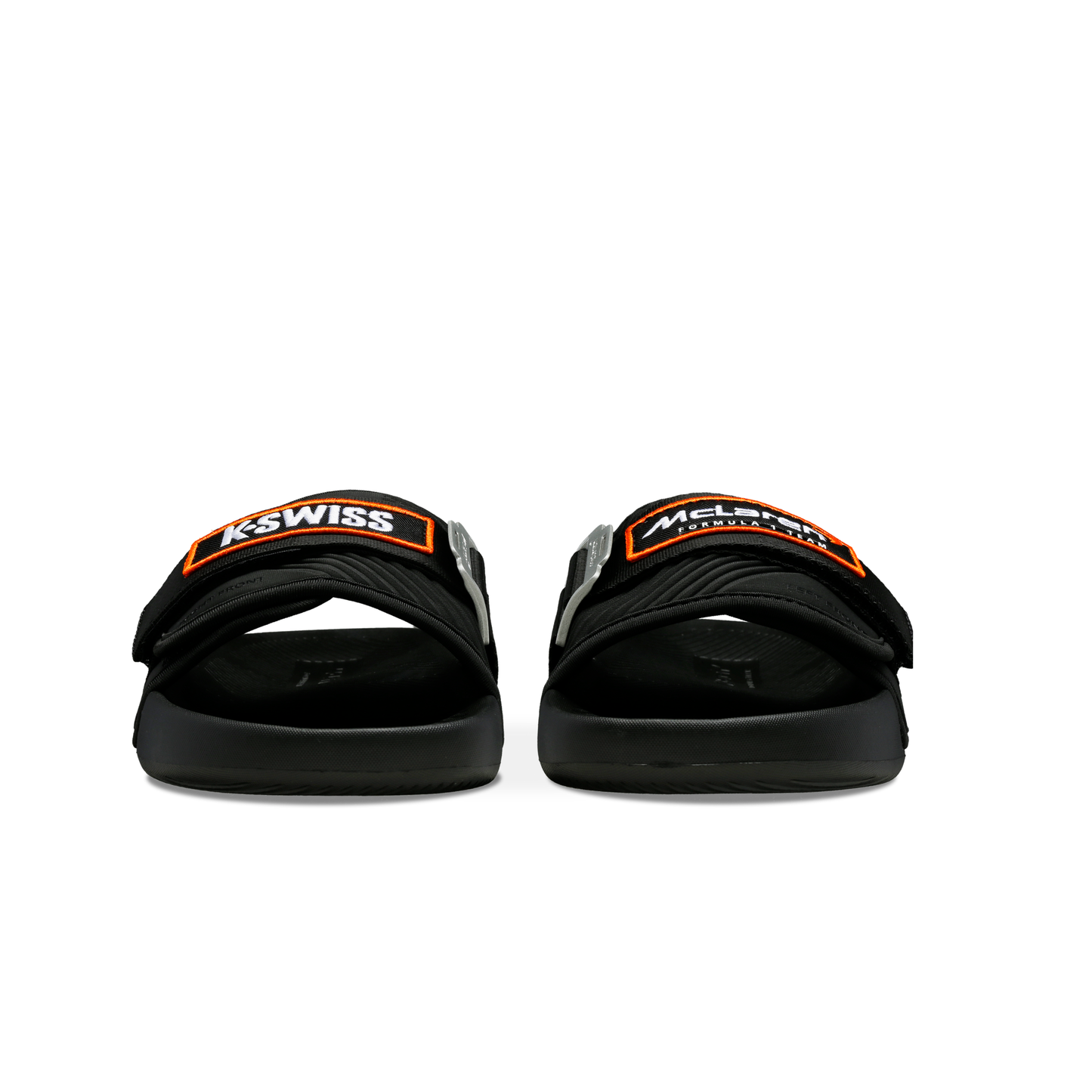 McLaren x K-Swiss black strap sandals with black and orange McLaren straps – front view of pair