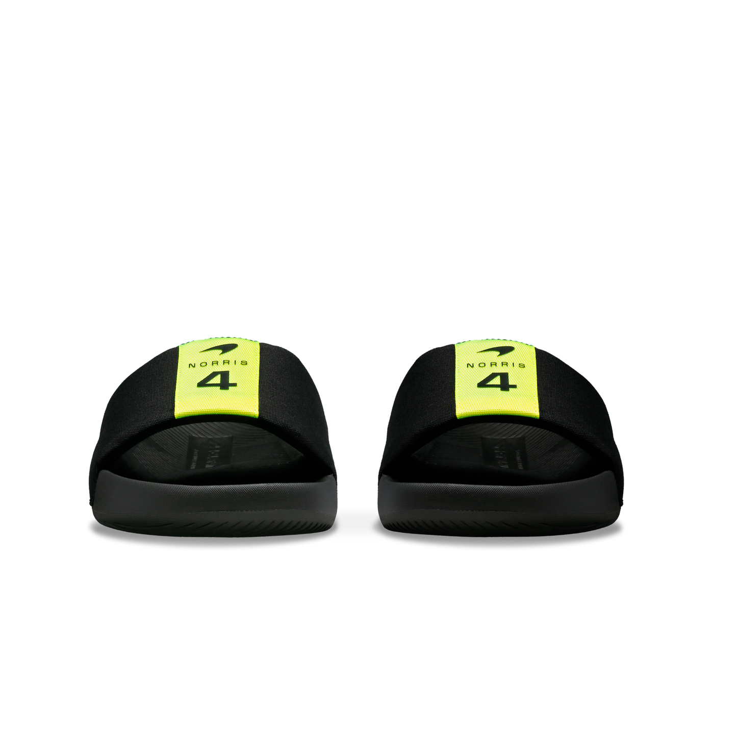 McLaren x K-Swiss black slide sandals with yellow 4 branded straps – front view of pair