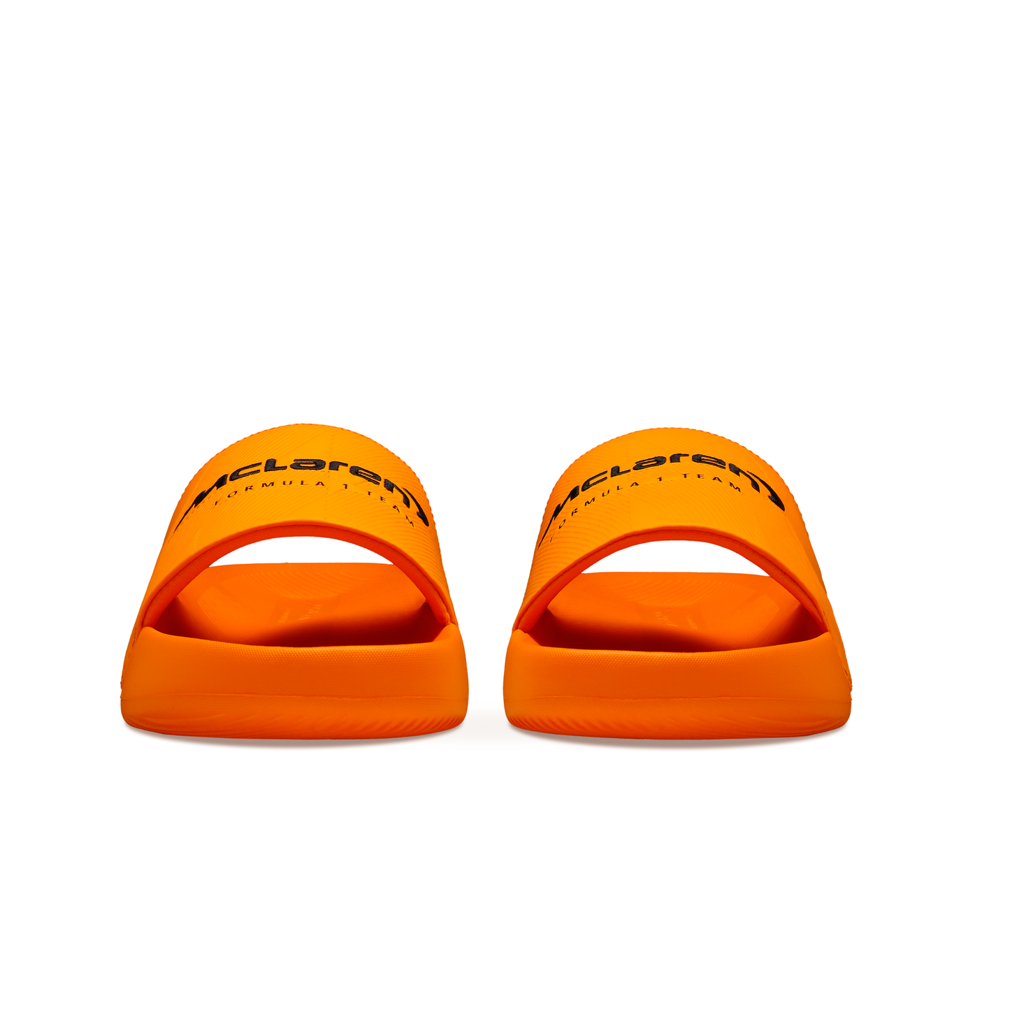 McLaren x K-Swiss papaya orange slide sandals with McLaren branding – front view of pair
