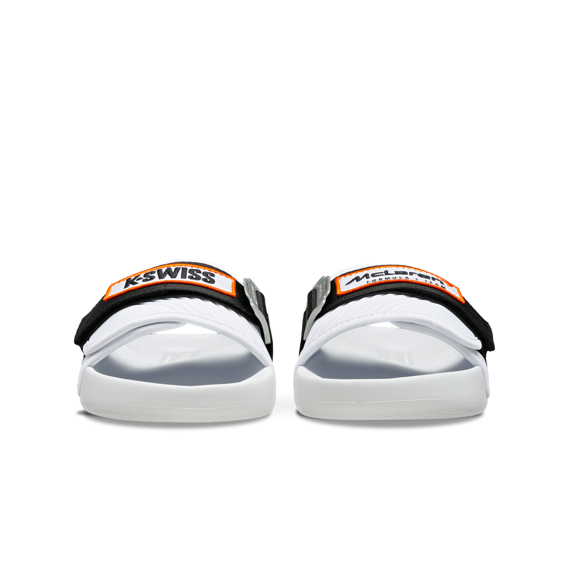 McLaren x K-Swiss white strap sandals with black and orange McLaren straps – front view of pair