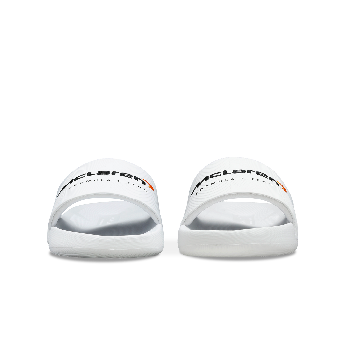 McLaren x K-Swiss white slide sandals with McLaren branding – front view of pair