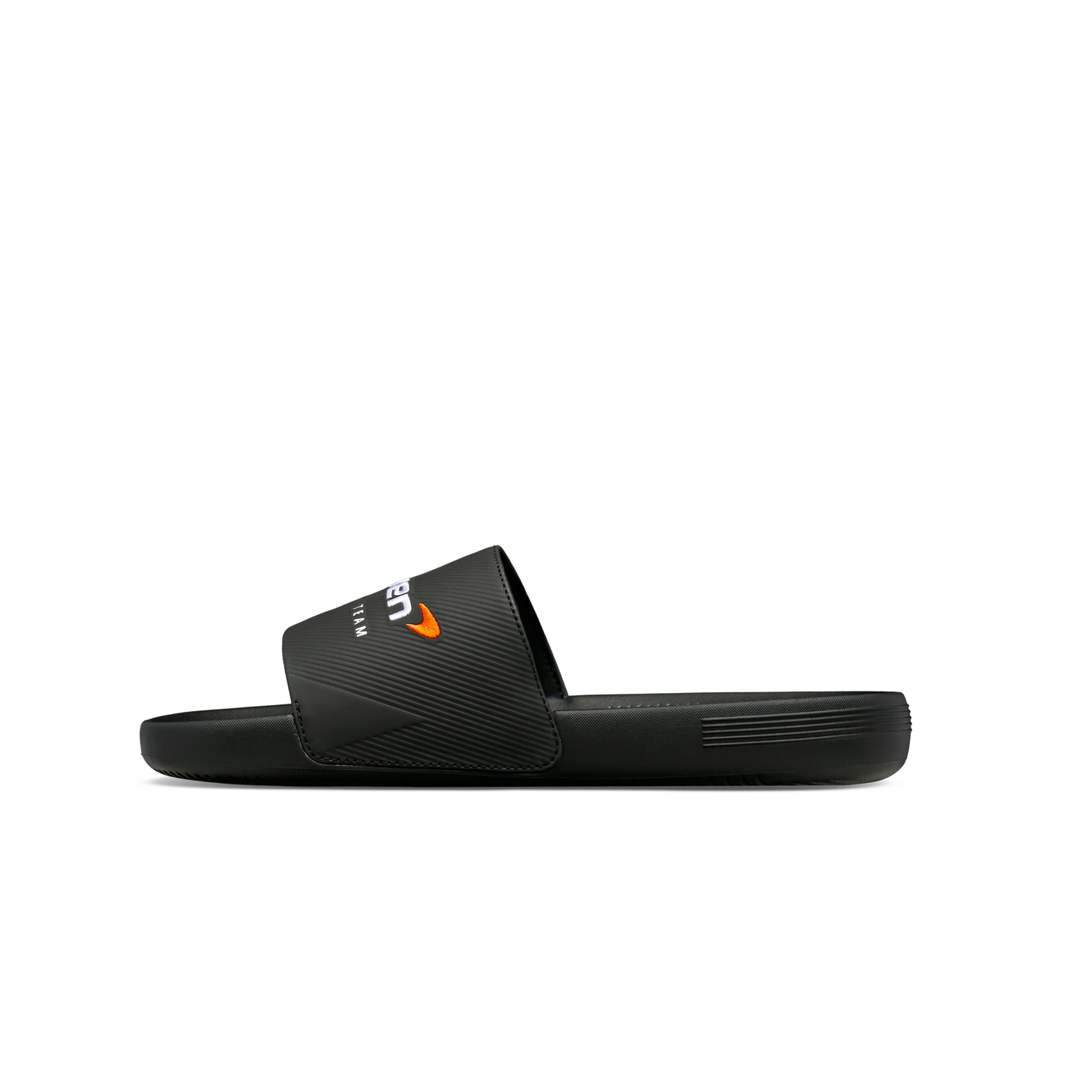 McLaren x K-Swiss black slide sandal with papaya McLaren logo strap detail – inner side profile view